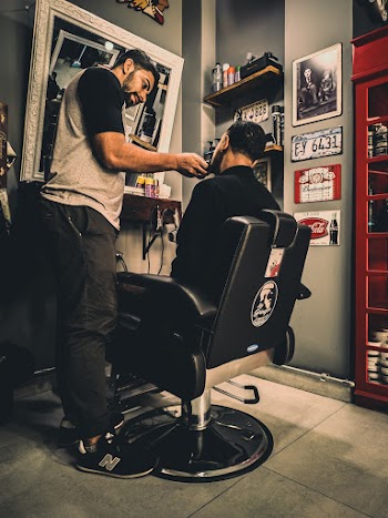 Man Shaving Another Man's Beard