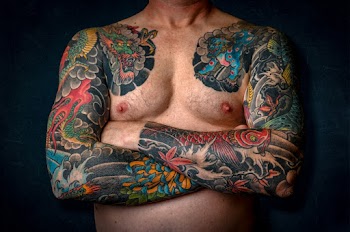 Man Showing His Arm Tattoos