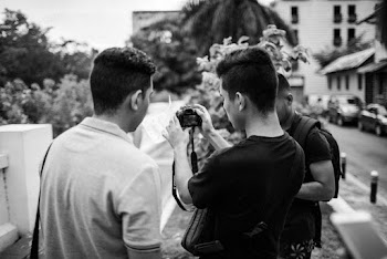 Man Showing His Camera To Other People
