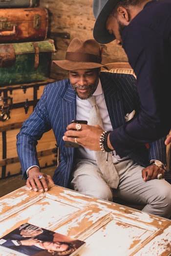 Man Showing Smartphone To Another Man