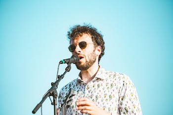 Man Singing Through Microphone