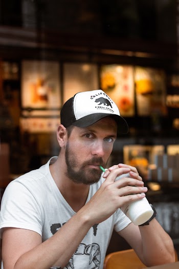 Man Sipping Straw