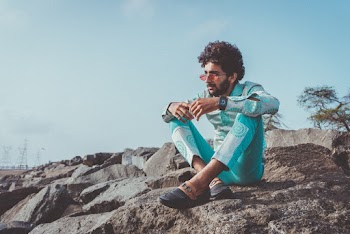 Man Siting on Focus Photography