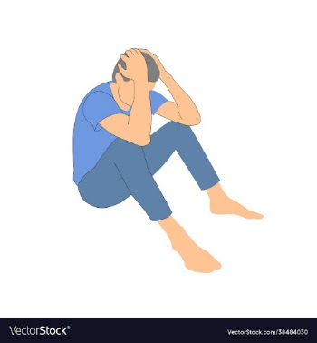 man sits and holds his head pose