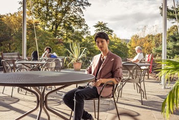Man Sits on Chair at Diner