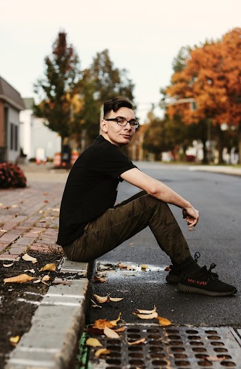 Man Sits on Gutter