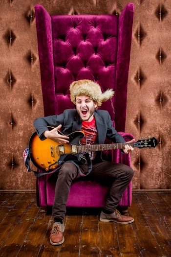 Man Sits on Sofa Chair