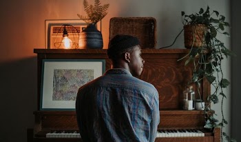 man sitting at the piano