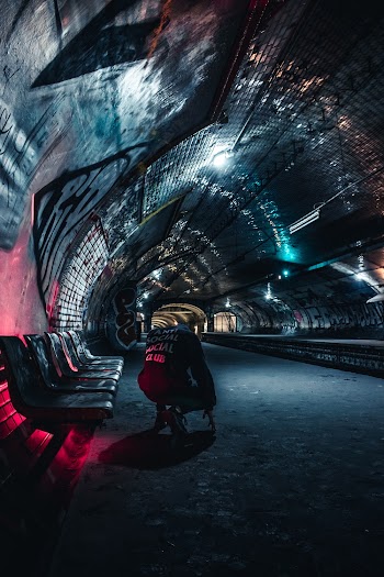 Man Sitting at Tunnel