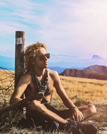 Man Sitting Beside Post
