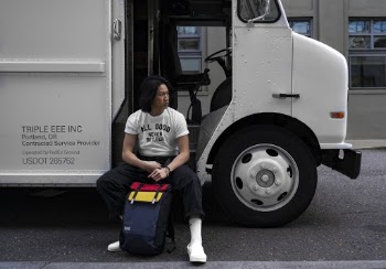 Man Sitting Beside White Truck