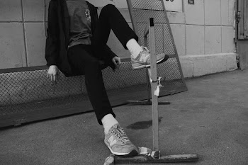 Man Sitting Down on Rails