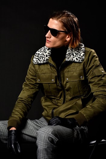 Man Sitting Down While Looking to the Side