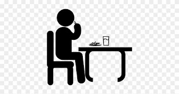 Man Sitting In Front Of A Table Eating And Drinking - Fake People