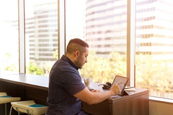 Man Sitting in Front of His Laptop