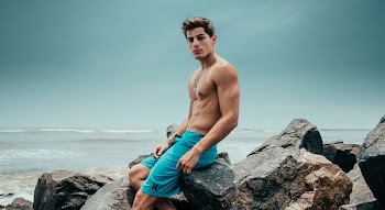 man sitting in the rock