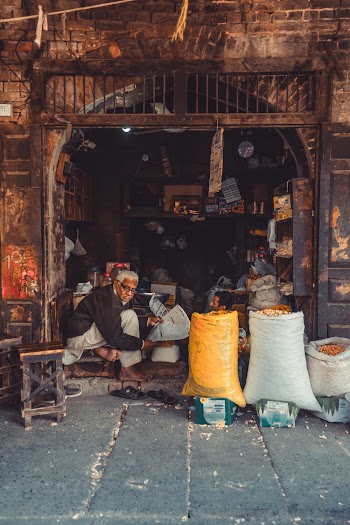 Man Sitting Inside A Store