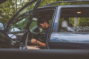 Man Sitting Inside Vehicle