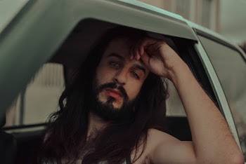 Man Sitting Inside Vehicle