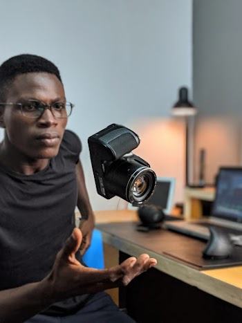 Man Sitting Near Camera