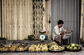 Man Sitting Near Fruits