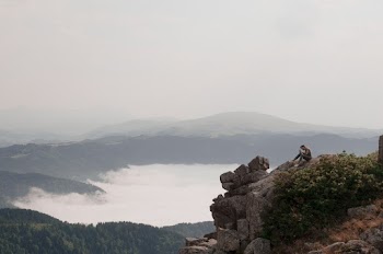 Man Sitting Near Rock Cliff