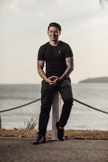 Man Sitting Near the Body of Water