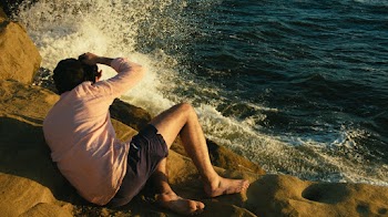 Man Sitting Near the Sea