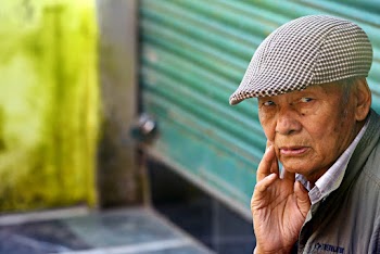 Man Sitting Near Wall