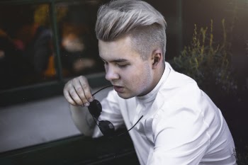 Man Sitting Near Window