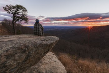 Man sitting on a cliff, | Free Photo - rawpixel