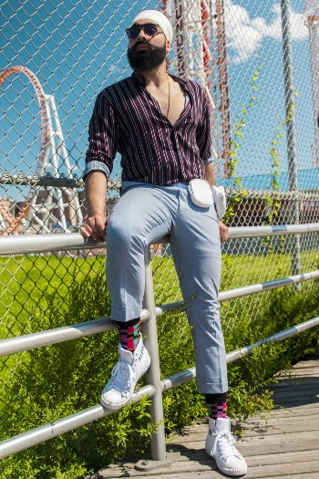 Man Sitting On A Railing