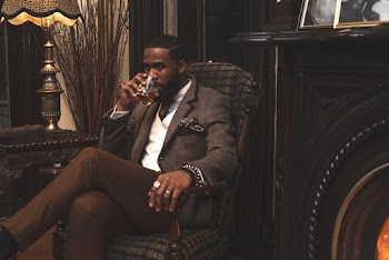 Man Sitting on Armchair