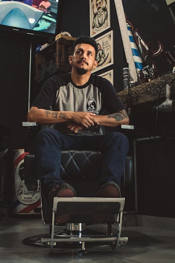 Man Sitting On Barber Chair 