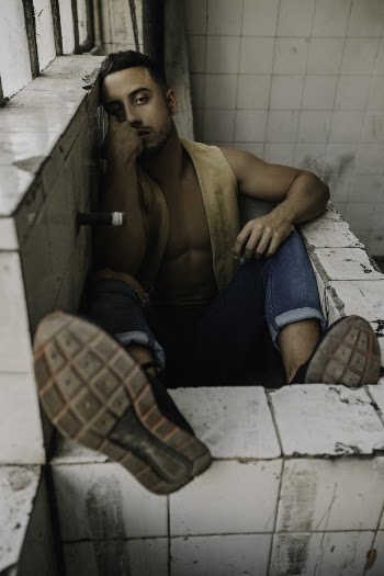Man Sitting on Bathtub
