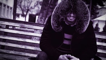 Man Sitting on Bench