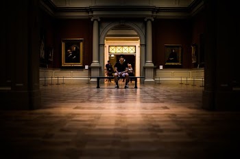 man sitting on bench on middle of house interior