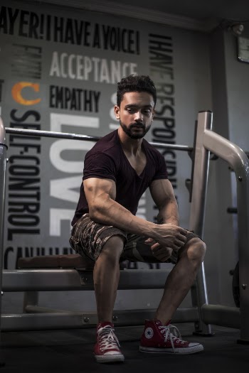 Man Sitting on Bench Press