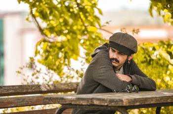 Man Sitting on Brown Picnic Bench