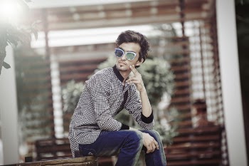 Man Sitting on Brown Wooden Chair