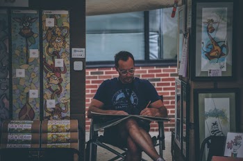 Man Sitting on Chair