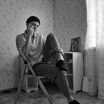 Man Sitting on Chair