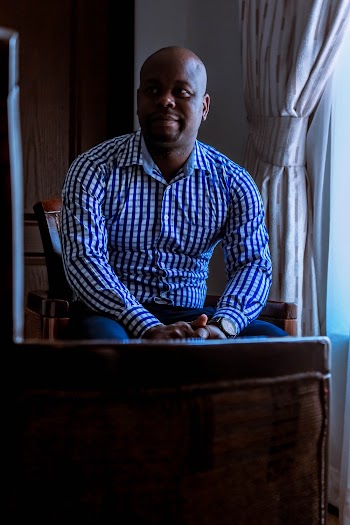 Man Sitting on Chair
