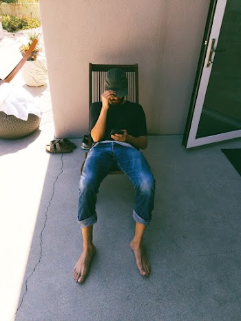 Man Sitting on Chair
