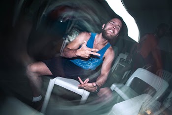 Man Sitting on Chair With Funny Expression