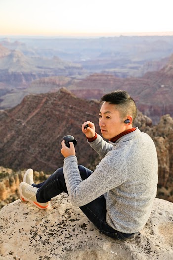 Man Sitting on Cliff