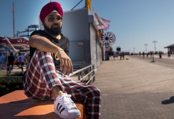 Man Sitting on Concrete Board