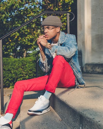 Man Sitting on Concrete Stairs