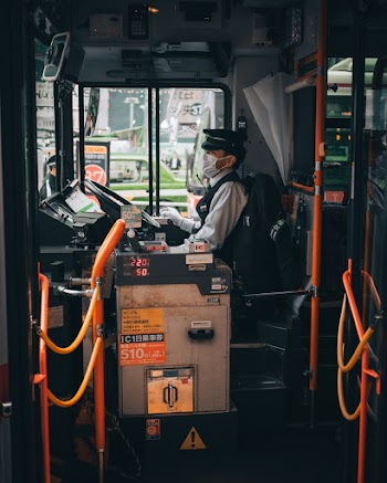 Man Sitting on Control Panel
