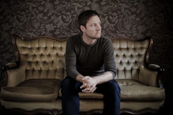 Man Sitting On Couch 